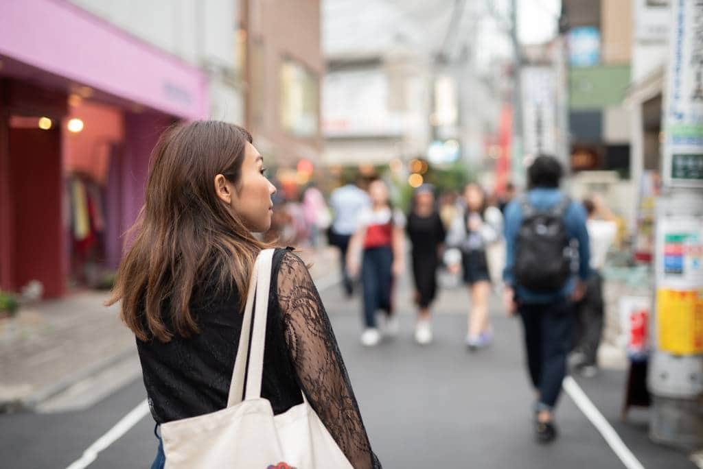 woman walking in Harajuku, Japanese famous sightseeing district for foreign tourists