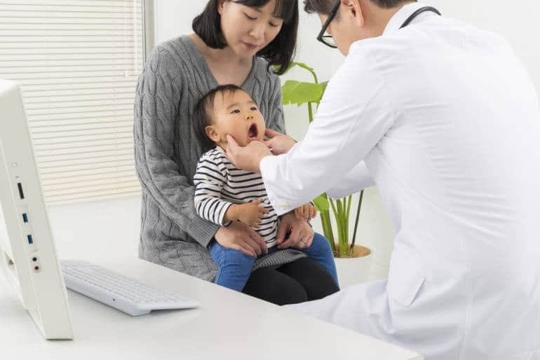 A child being examined by a doctor in Japan