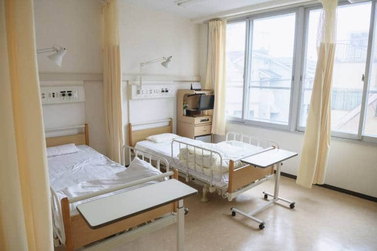 Two empty beds in hospital ward Japan