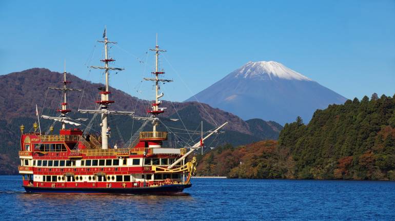Sightseeing ship at lake Ashi and Mountain Fuji in background