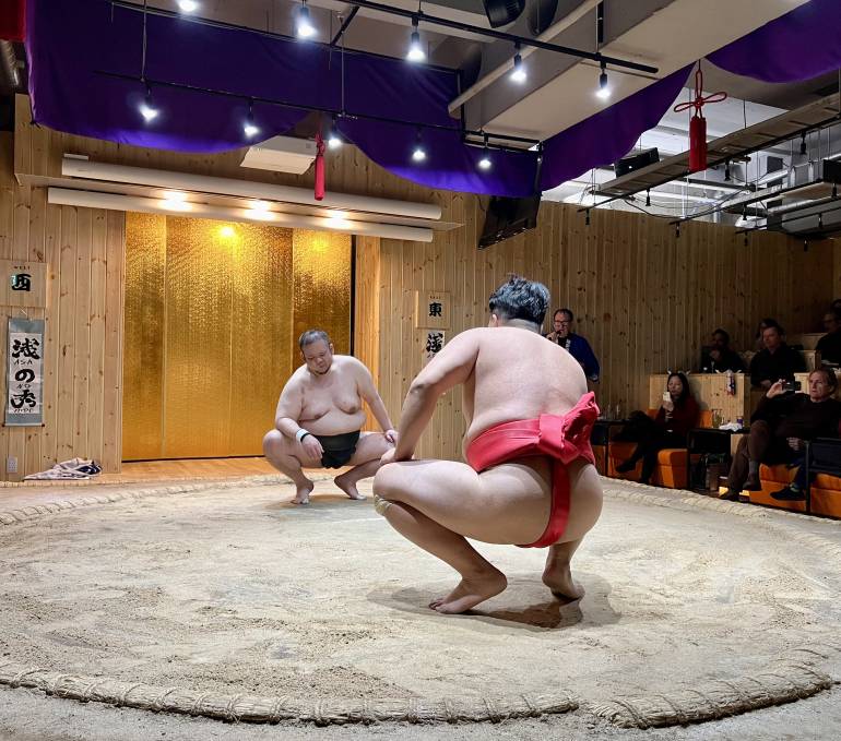 Two retired sumo wresters square off at an Asakusa sumo restaurant